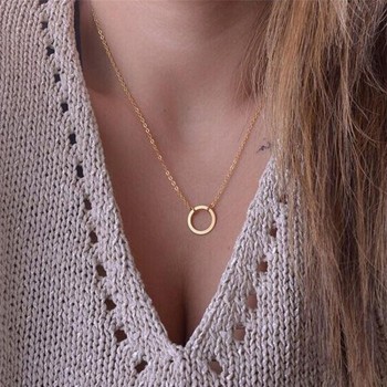 Golden necklace with round pendant